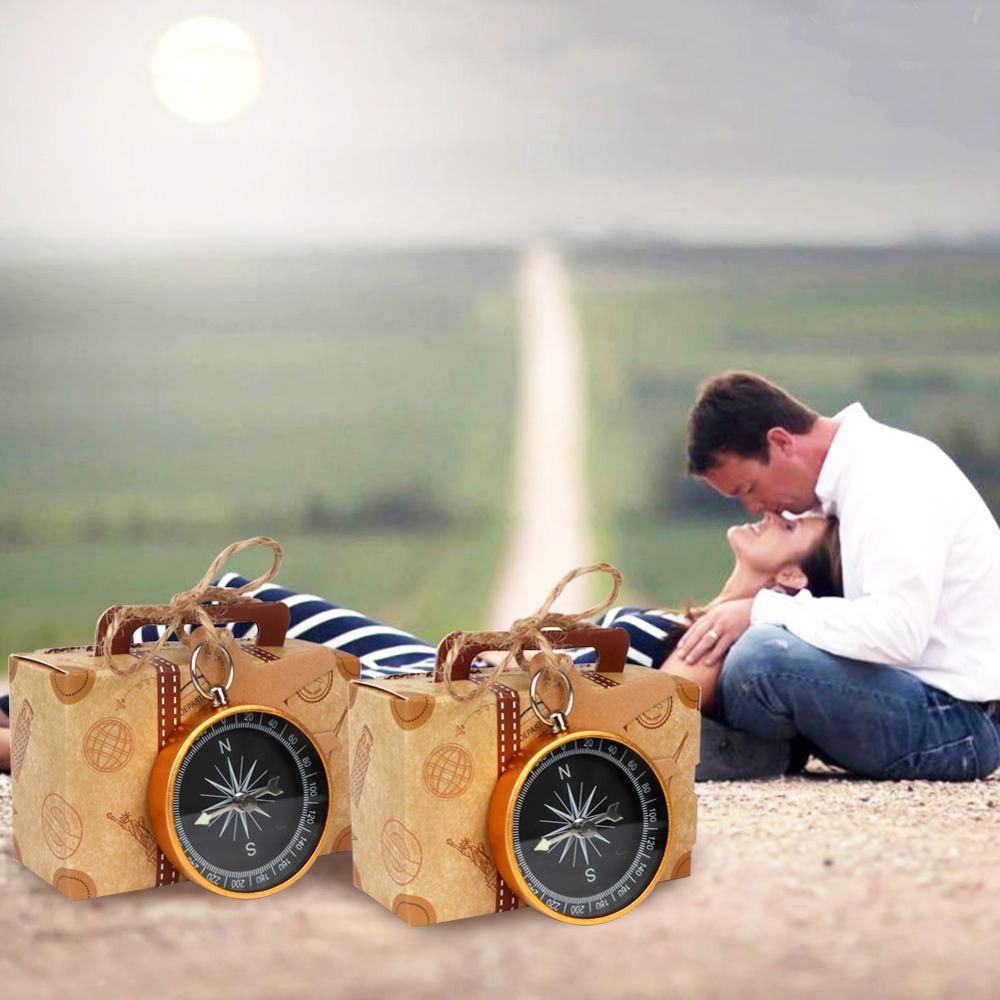 Caja de 60 brújulas en caja maleta con tarjeta